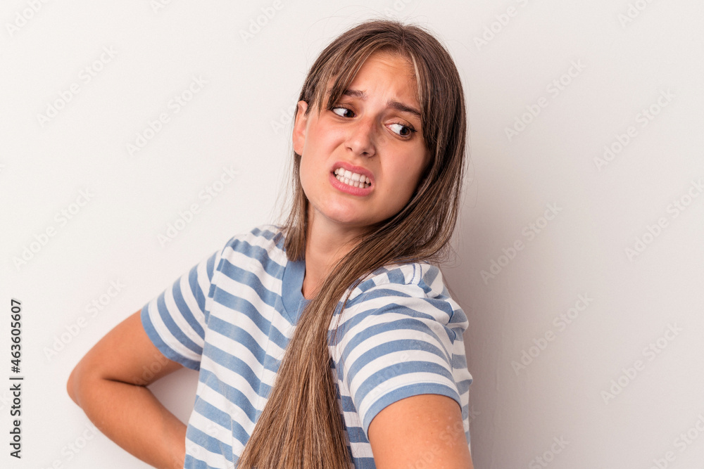 Young caucasian woman isolated on white background suffering a back pain. Young caucasian woman isolated on white background suffering a back pain.