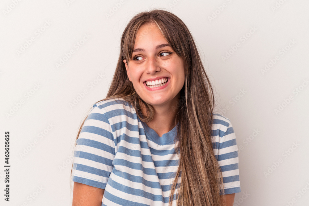 Young caucasian woman isolated on white background laughs and closes eyes, feels relaxed and happy. Young caucasian woman isolated on white background laughs and closes eyes, feels relaxed and happy.