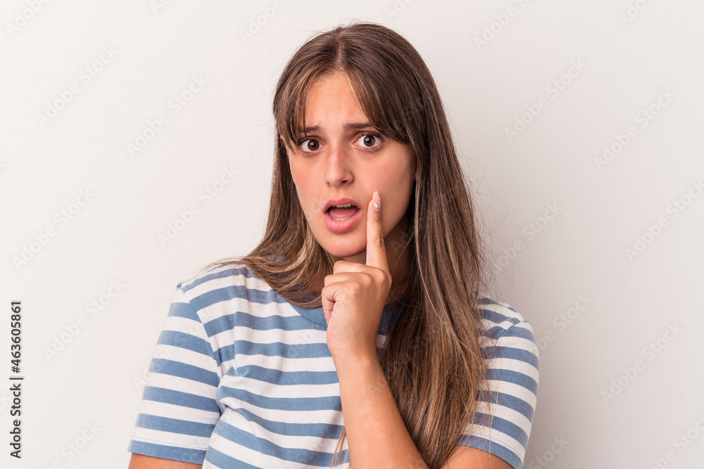 Young caucasian woman isolated on white background looking sideways with doubtful and skeptical expression. Young caucasian woman isolated on white background looking sideways with doubtful and skeptical expression.