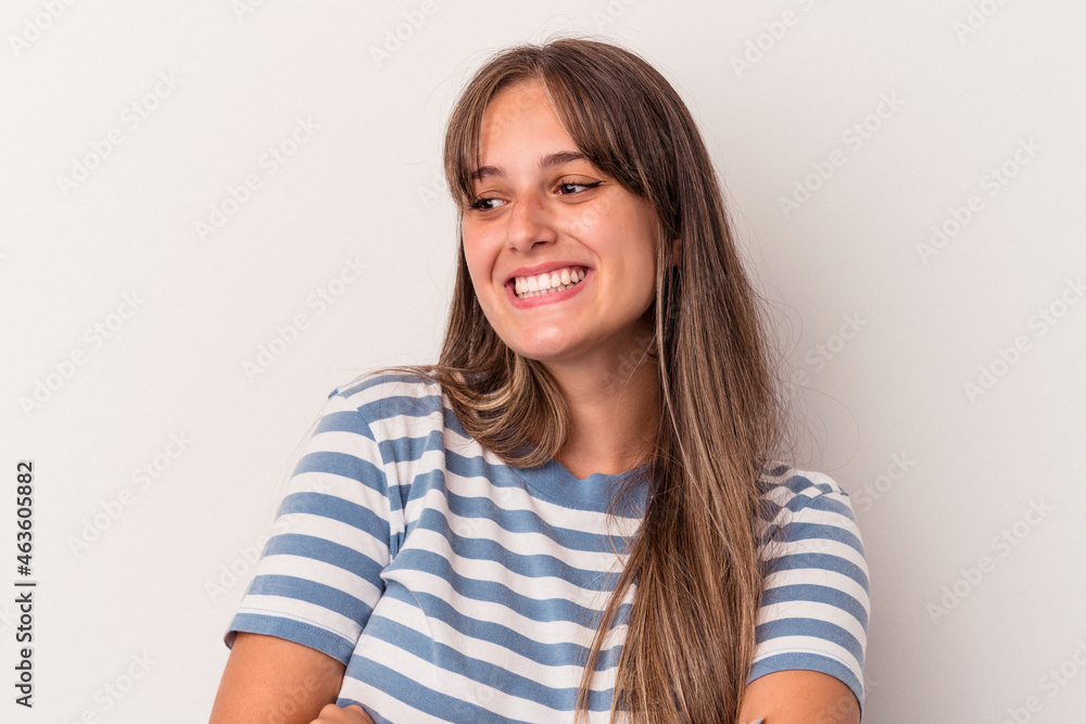 Young caucasian woman isolated on white background smiling confident with crossed arms.