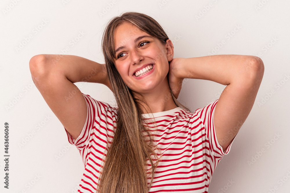 Young caucasian woman isolated on white background feeling confident, with hands behind the head. Young caucasian woman isolated on white background feeling confident, with hands behind the head.