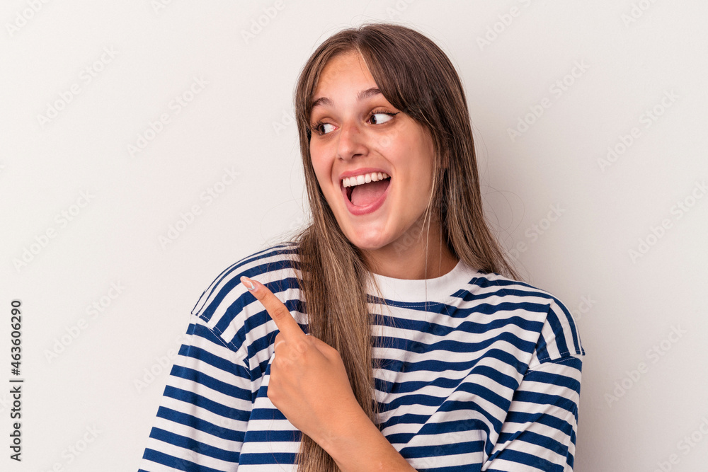 Young caucasian woman isolated on white background looks aside smiling, cheerful and pleasant. Young caucasian woman isolated on white background looks aside smiling, cheerful and pleasant.
