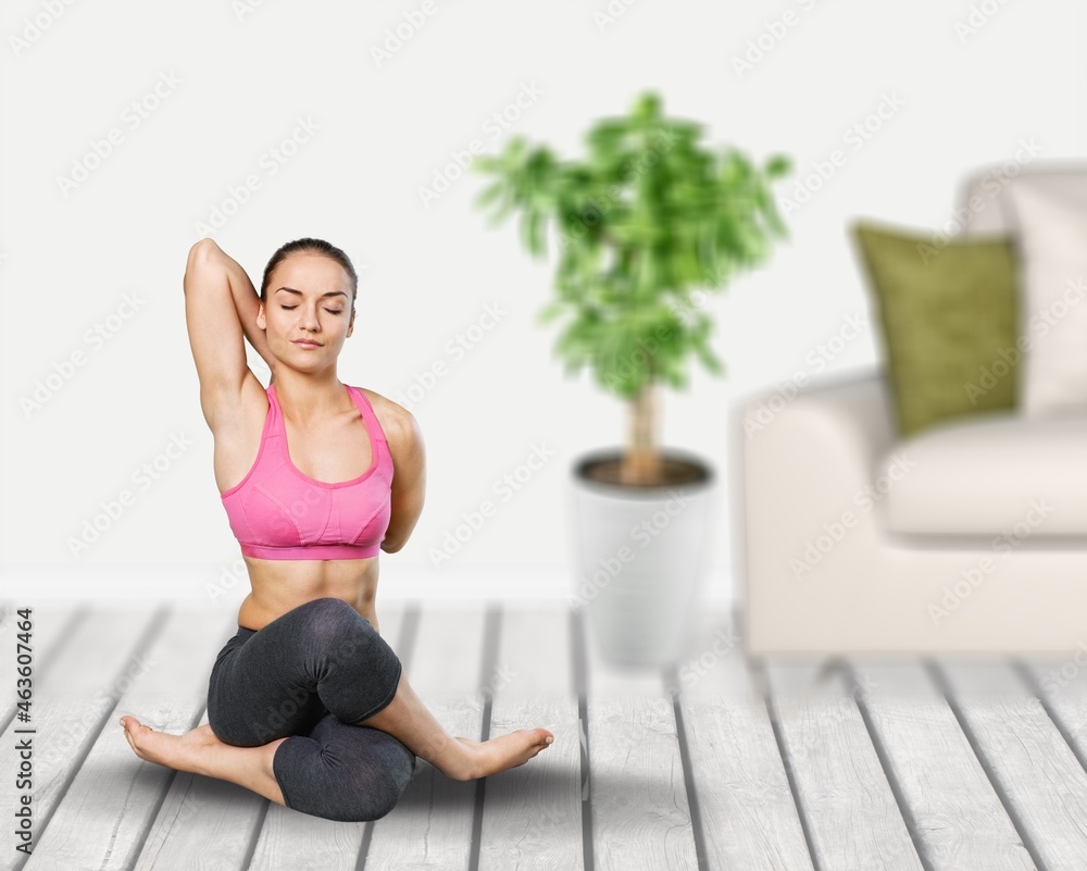 The girl does yoga, woman at home practices asanas. Hands on chest, mudra. The girl does yoga, woman at home practices asanas. Hands on chest, mudra.