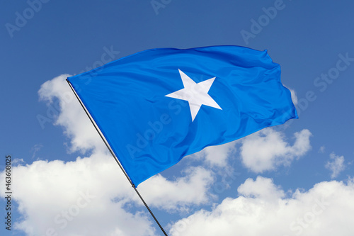 Somalia flag isolated on the blue sky background. close up waving flag of Somalia. flag symbols of Somalia. Concept of Somalia.