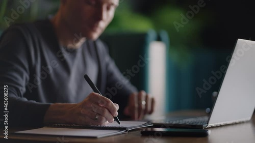 Hispanic latin man college student using laptop computer watching distance online learning seminar class, remote university webinar or having virtual classroom meeting in university creative space.