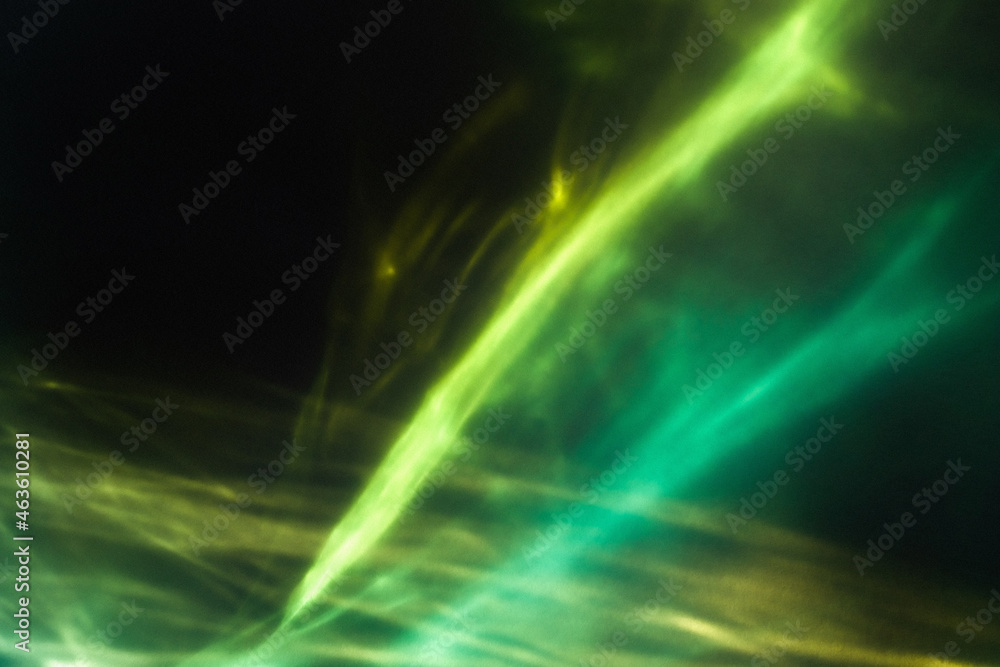 Blue and green northern light on black background. Magic abstract night sky wallpaper. Neon grainy gradient overlay