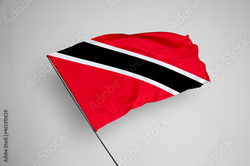 Trinidad and Tobago flag isolated on white background. close up waving flag of Trinidad and Tobago. flag symbols of Trinidad and Tobago. Concept of Trinidad and Tobago. photo