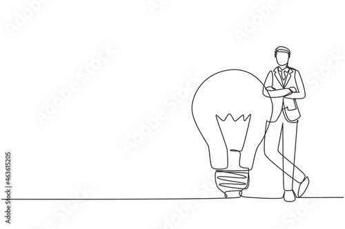 Continuous one line drawing businessman leaning on giant lightbulb, business idea. Business people have ideas leaning against the lamp symbol is good idea. Single line draw design vector illustration