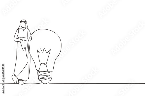 Single continuous line drawing Arab businessman leaning on giant lightbulb, business idea. Business people ideas leaning against the lamp symbol is good idea. One line draw design vector illustration