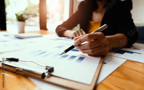 Close up view of bookkeeper or financial inspector hands making report, calculating or checking balance. Home finances, investment, economy, saving money or insurance concept.