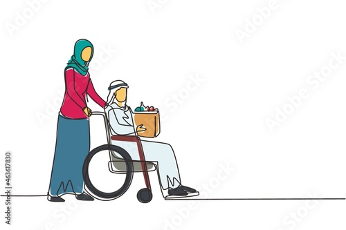 Single continuous line drawing social worker helping old man on wheelchair with grocery shopping. Arab female volunteer caring and walking with disabled senior male to shopping. One line design vector