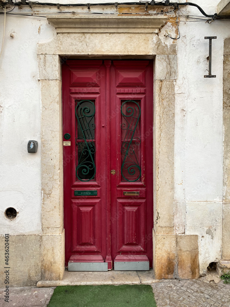 Old red door of Portuguese algarve village