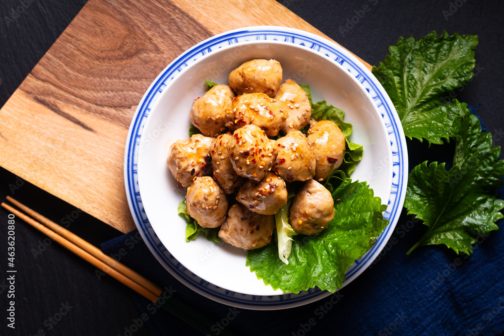 Food concept homemade Asian Meatballs with sweet and spicy soy sauce on wooden board with copy space Food concept homemade Asian Meatballs with sweet and spicy soy sauce on wooden board with copy space