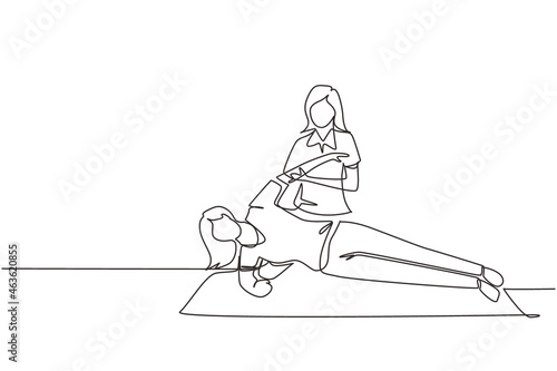 Single continuous line drawing woman patient lying on the floor masseur therapist doing healing treatment massaging patient body manual sport physical therapy. One line draw design vector illustration