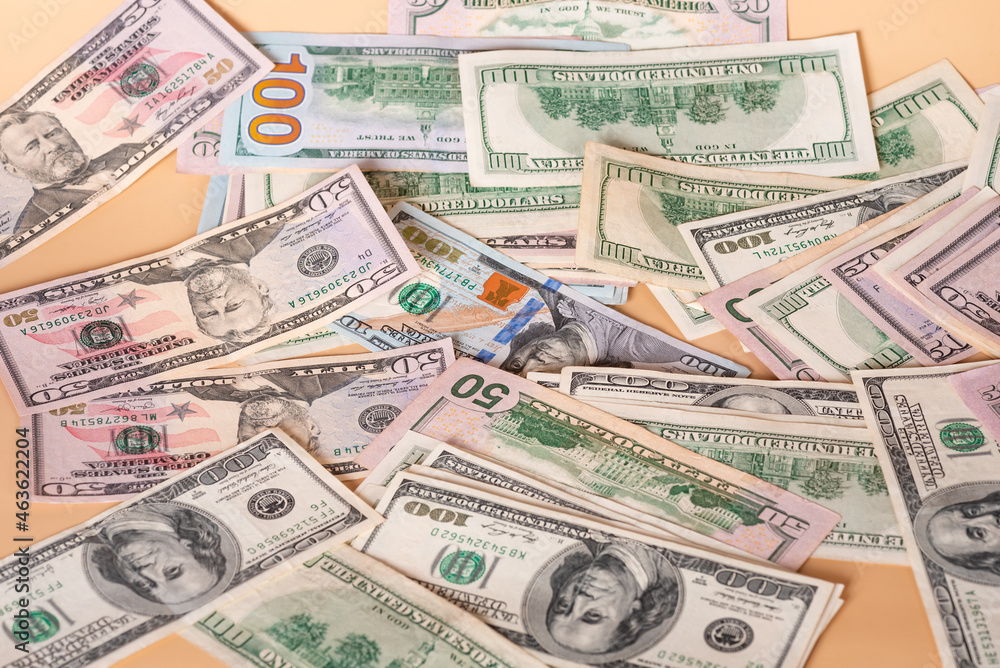 Dollars on a beige background. Financial savings and income. Dollars on a beige background. Financial savings and income.