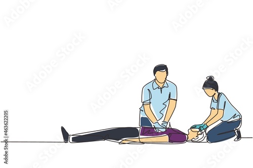 Single continuous line drawing emergency doctors doing cardiopulmonary resuscitation of a man. Paramedic giving indirect heart massage first aid to patient. One line draw design vector illustration