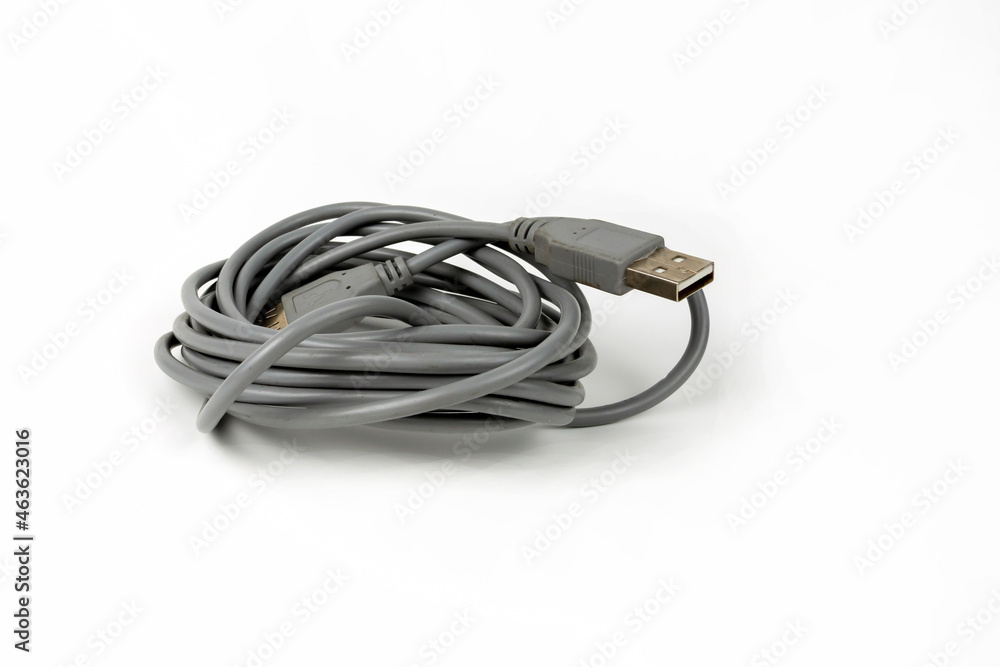 connecting cord for USB connectors of a personal computer coiled into a tight coil. copy space connecting cord for USB connectors of a personal computer coiled into a tight coil. copy space