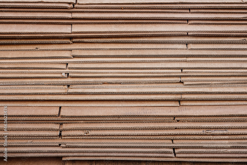 Close-up photo of brown cardboard sheets from under the boxes Close-up photo of brown cardboard sheets from under the boxes