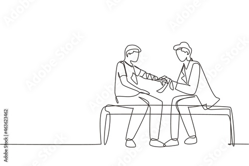 Single continuous line drawing doctor bandages patient man hand. First aid emergency hands doing dressing bandage in Traumatology clinic. Medical treatment in hospital. One line draw design vector