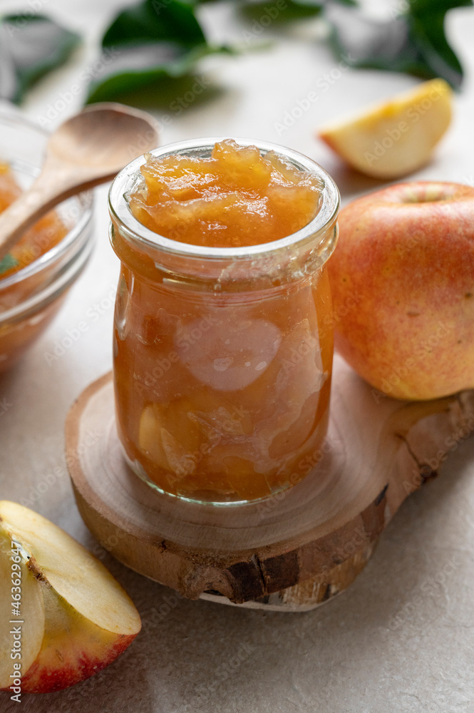 Apple jam in glass jar, delicious fruit jam, rustic style, day natural light. Apple jam in glass jar, delicious fruit jam, rustic style, day natural light.