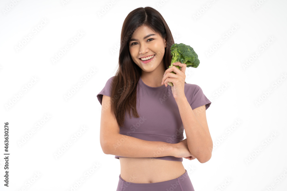 Portrait of young happy and healthy Asian woman holding Block Curry and looking at camera on white Isolated background. Concept of vegetarian diet, healthy lifestyle with healthy food. Portrait of young happy and healthy Asian woman holding Block Curry and looking at camera on white Isolated background. Concept of vegetarian diet, healthy lifestyle with healthy food.