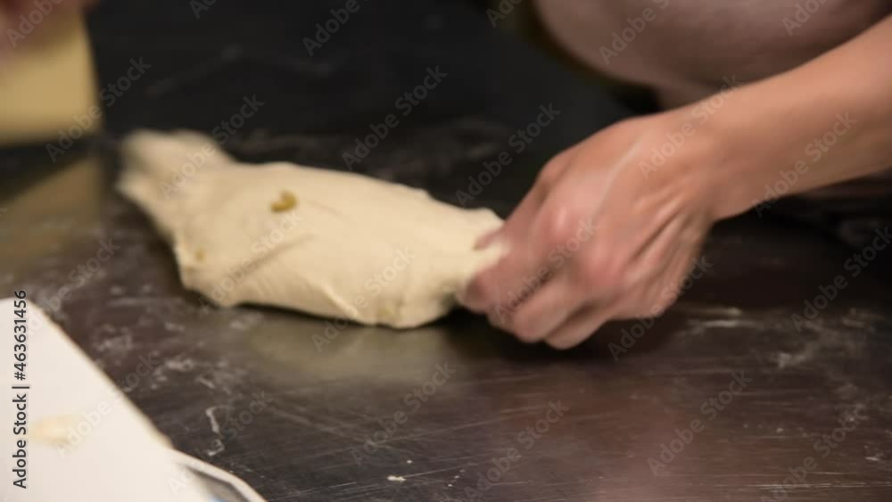Close-up of weighing dough before baking bread. Craft bakery. Fast Professional Work of Bakers Close-up of weighing dough before baking bread. Craft bakery. Fast Professional Work of Bakers