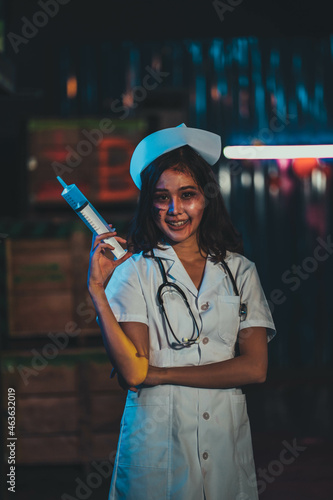 Horror scary evil insane nurse doctor held the knife, Zombie woman gosth with halloween concept photo