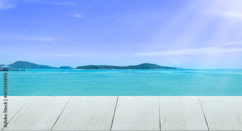 Fototapeta premium Beautiful wooden floor and blue background, sea water and sky.