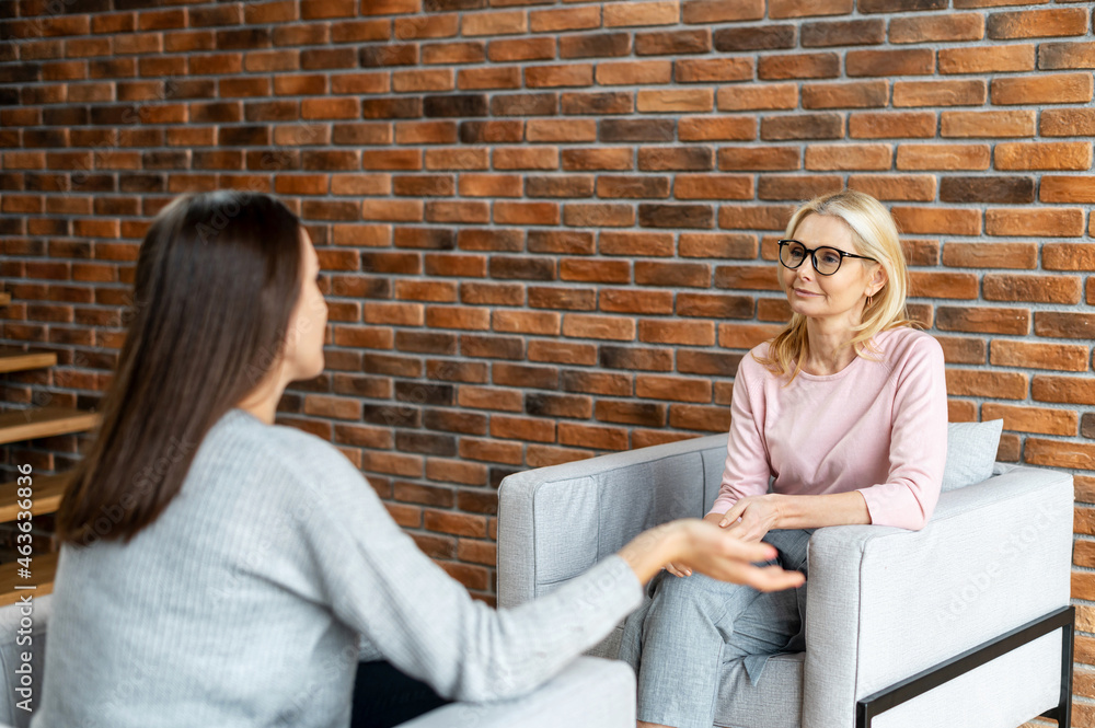 The therapist expresses support and empathy to a upset female patient during therapy session. Mental health concept The therapist expresses support and empathy to a upset female patient during therapy session. Mental health concept
