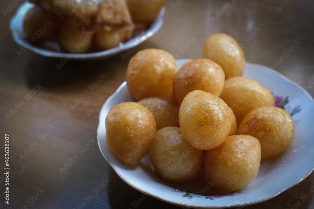 Loukoumades is a traditional Greek, Cypriot pastry consisting of a deep-fried dough ball with honey and sugar. Italian zeppole or Struffoli or Turkish lokma. Loukoumades is a traditional Greek, Cypriot pastry consisting of a deep-fried dough ball with honey and sugar. Italian zeppole or Struffoli or Turkish lokma.