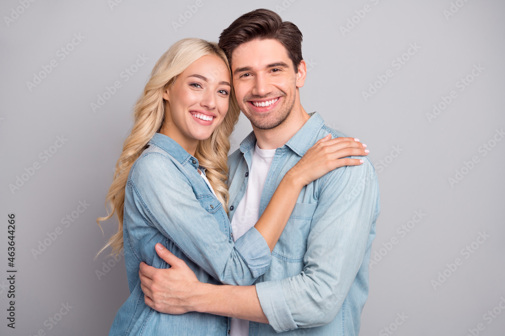 Portrait of attractive cheery tender couple hugging bonding idyllic day isolated over gray pastel color background Portrait of attractive cheery tender couple hugging bonding idyllic day isolated over gray pastel color background