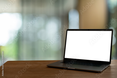 laptop on wooden table