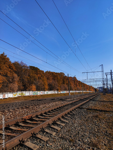 A beautiful autumn season, which depicts a forest, rails, houses, rivers, seas.