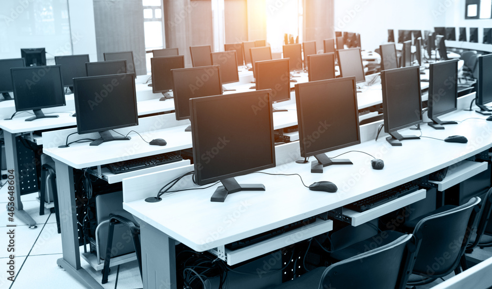 Group of computer neatly placed in a computer lab. Group of computer neatly placed in a computer lab.
