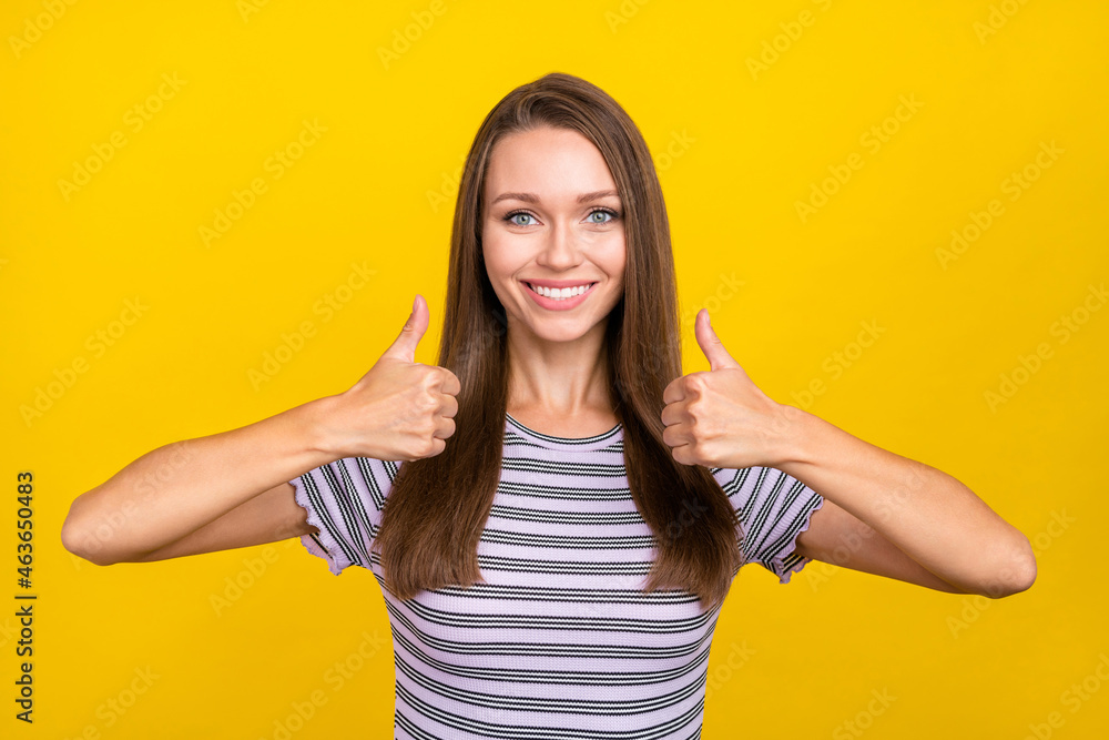 Photo of joyful nice happy young woman make thumb up recommend cool isolated on yellow color background Photo of joyful nice happy young woman make thumb up recommend cool isolated on yellow color background