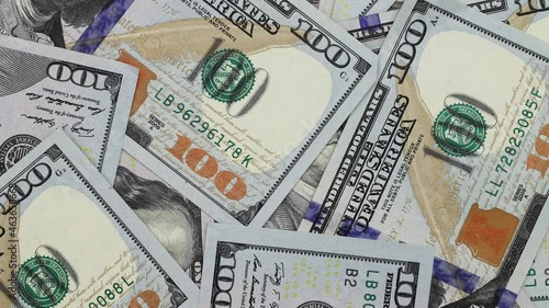 Money. Many 100 dollar bills rotate in a circle. Close-up, top view. Stop motion.