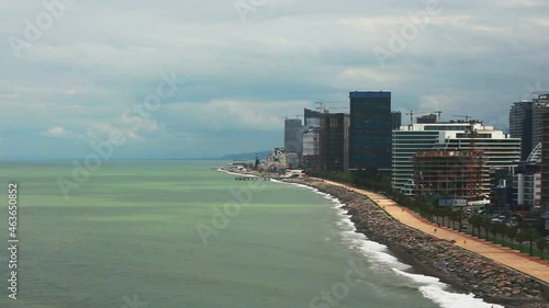 Airplane landing at the airport in the city. View from the illuminator. Batumi. Georgia