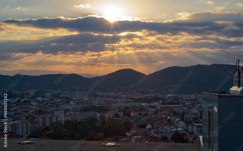 Beautiful sunset scenery with view on city Graz in Styria, Austria from Schloßberg. 