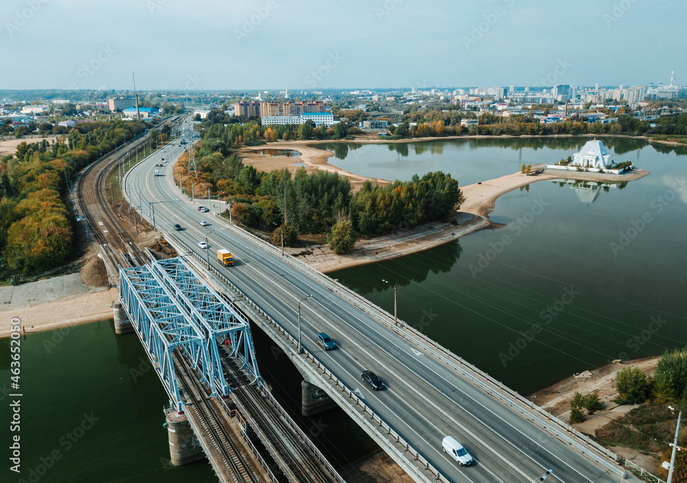 Top up aerial drone view of road and traffic in Kazan city during sunny day.
