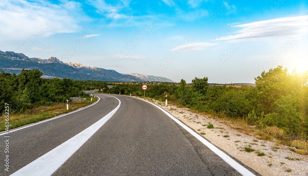 Scenic road. The road is surrounded by a magnificent natural landscape.