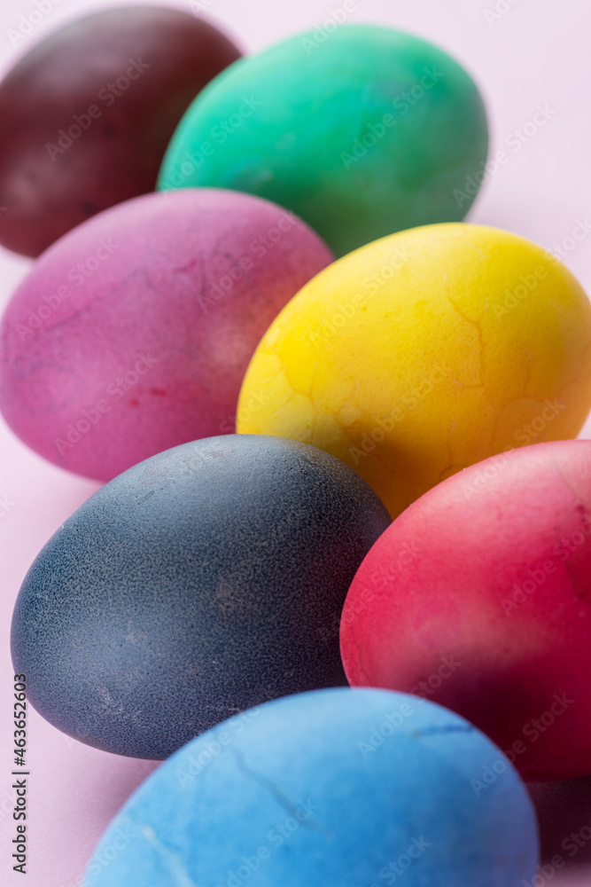 Colorful Easter eggs as an attribute of Easter celebration. Pink background. Colorful Easter eggs as an attribute of Easter celebration. Pink background.