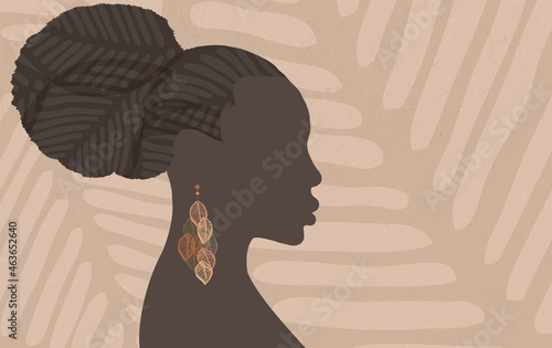 Face silhouette of ethnic African woman in profile with earring made of leaf shapes. Grunge textured background