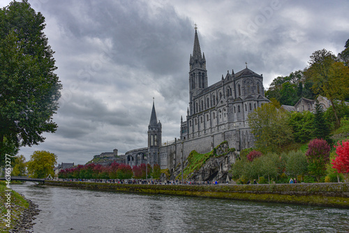Lourdes, France - 9 Oct 2021: Views of the Rosary Basilica Church from the Gave de Pau river in Lourdes photo