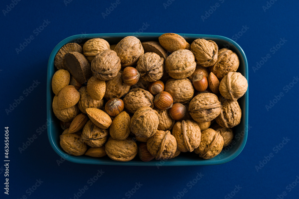 Brazilian nuts, walnuts, almonds on Winter and Christmas background Brazilian nuts, walnuts, almonds on Winter and Christmas background