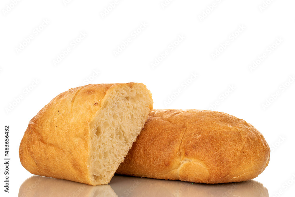 One whole and one half fragrant ciabatta, close-up, isolated on white.