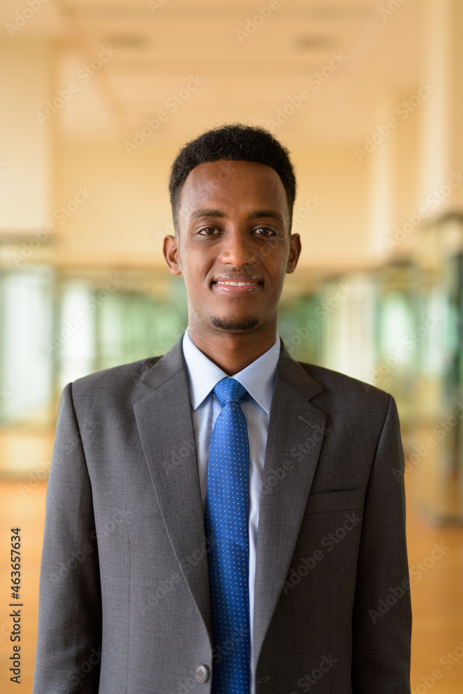 Portrait of handsome African businessman wearing suit and tie
