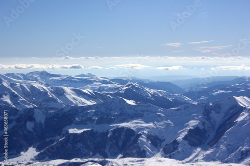 snow covered mountains in winter © Dmitrii Lanskikh