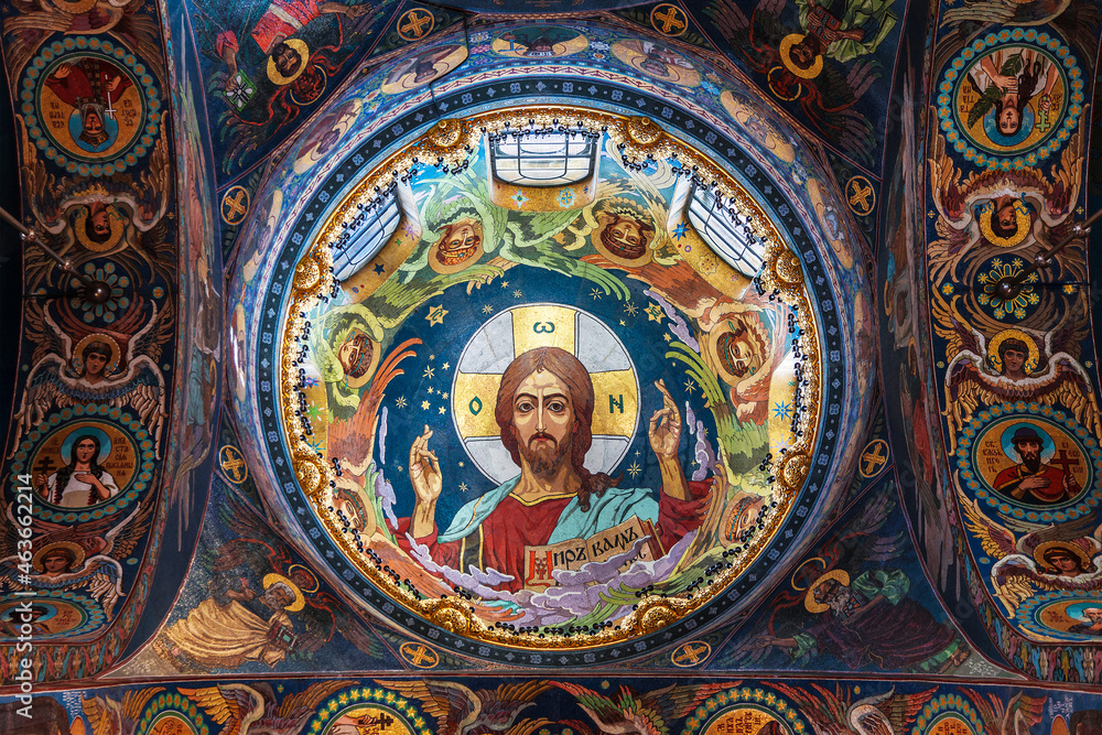 The interior of the Church of the Savior on Blood. Central mosaic image of Christ Pantokrator in the plafond of the central dome. Saint-Petersburg, Russia
