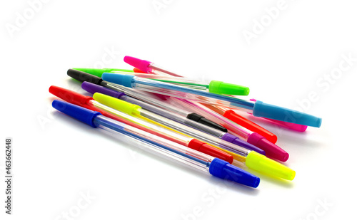 Multicolored pens isolated on white background. Ballpoint pens lie on white.