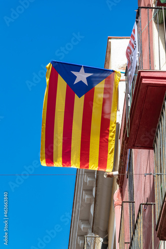 Catalan independence flag hanging from a window demanding the independence of Catalonia photo